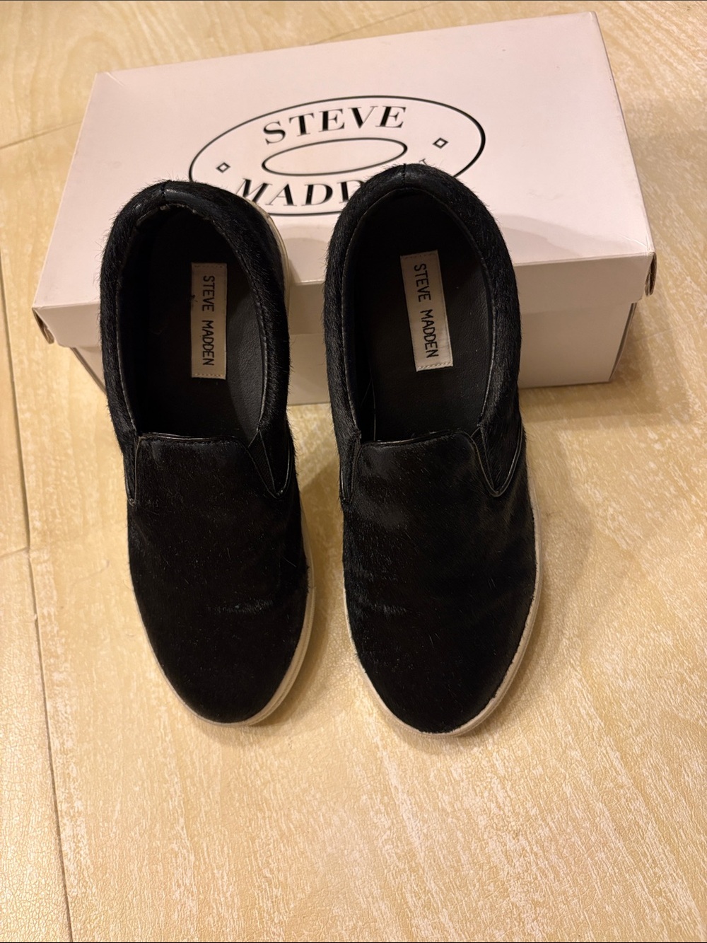 Steve Madden black slip-ons